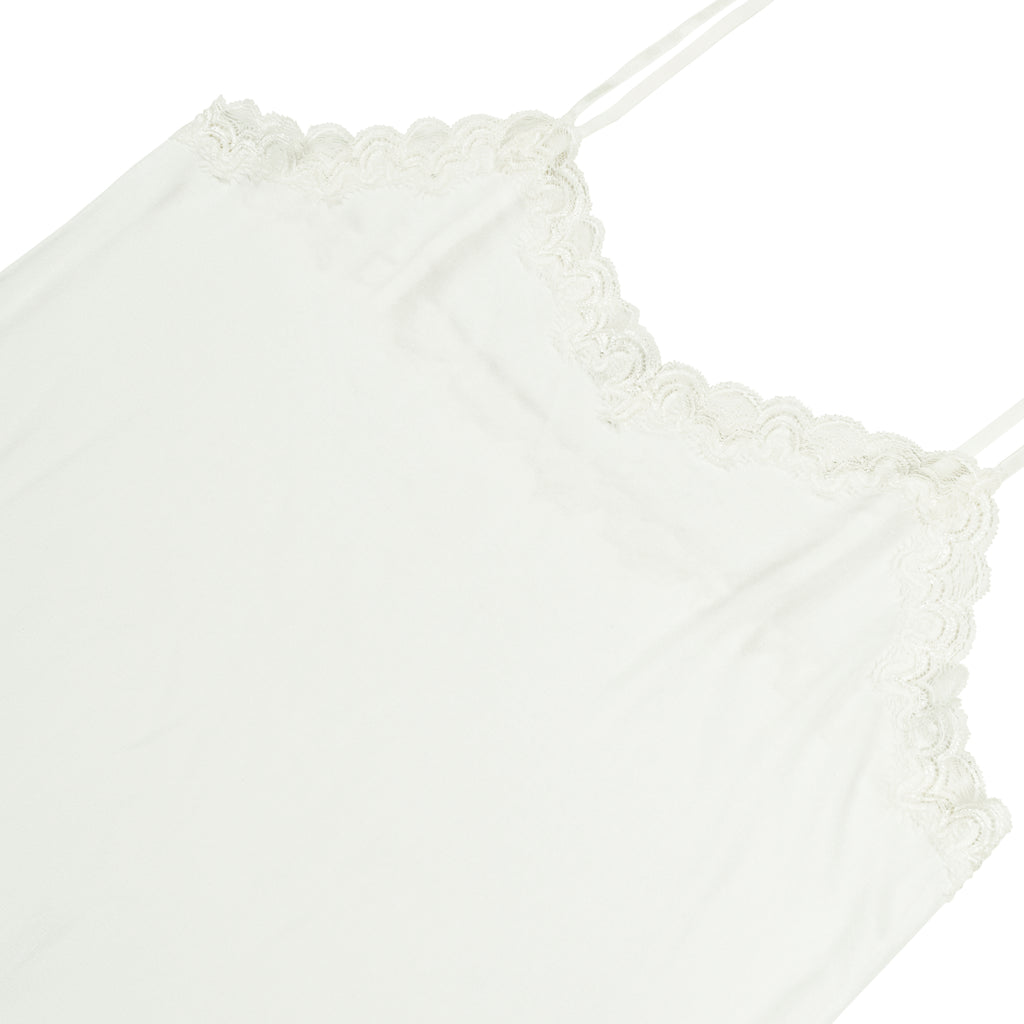 Still life of Uwila Warrior Silk Blend Slip in Soft White on White Background