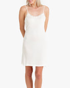 Model wearing Uwila Warrior Silk Blend Slip in Soft White on White Background