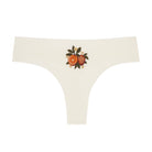 Winter White Soft Seamless Thong with orange embroidery on white background