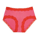 Soft Silk camelia rose brief with contrasting fiery red lace on a white background. 