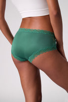 Model wearing Uwila Warrior Soft Silk Briefs in Smoke Pine.