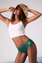 Model wearing Uwila Warrior Pineapple Soft Silk Brief with Beach hat. 