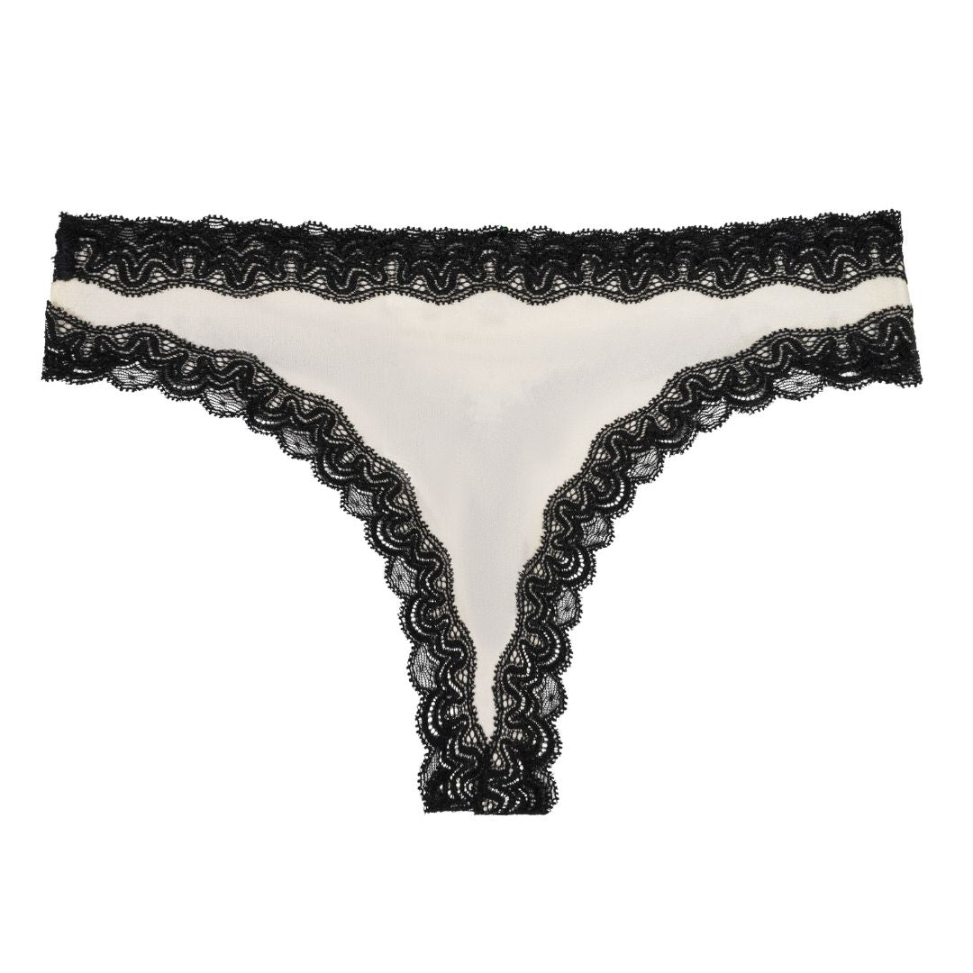 Soft Silk Winter White Thong with contrasting Tap Shoe Black Lace on a white background. 