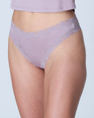 Model wearing Uwila Warrior Soft Silks Thong Underwear in NIrvana on White Background