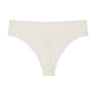 Still life of Uwila Warrior Soft Silks Thong Underwear in Winter White on White Background