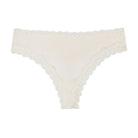 Still life of Uwila Warrior Soft Silks Thong Underwear in Winter White on White Background