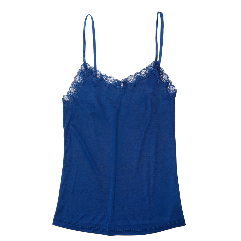 Still life of Uwila Warrior Soft Silks Camisole in Estate Blue on White Background