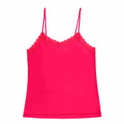 Still life of Uwila Warrior Soft Silks Camisole in Raspberry on White Background