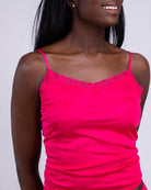 Model wearing Uwila Warrior Soft Silks Camisole in Raspberry on White Background