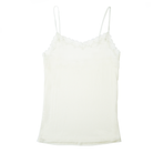 Still life of Uwila Warrior Soft Silks Camisole in Winter White on White Background