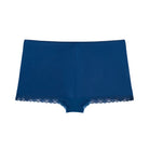 Still life of Uwila Warrior Soft Silk Sleep Shorts  in Estate Blue on White Background