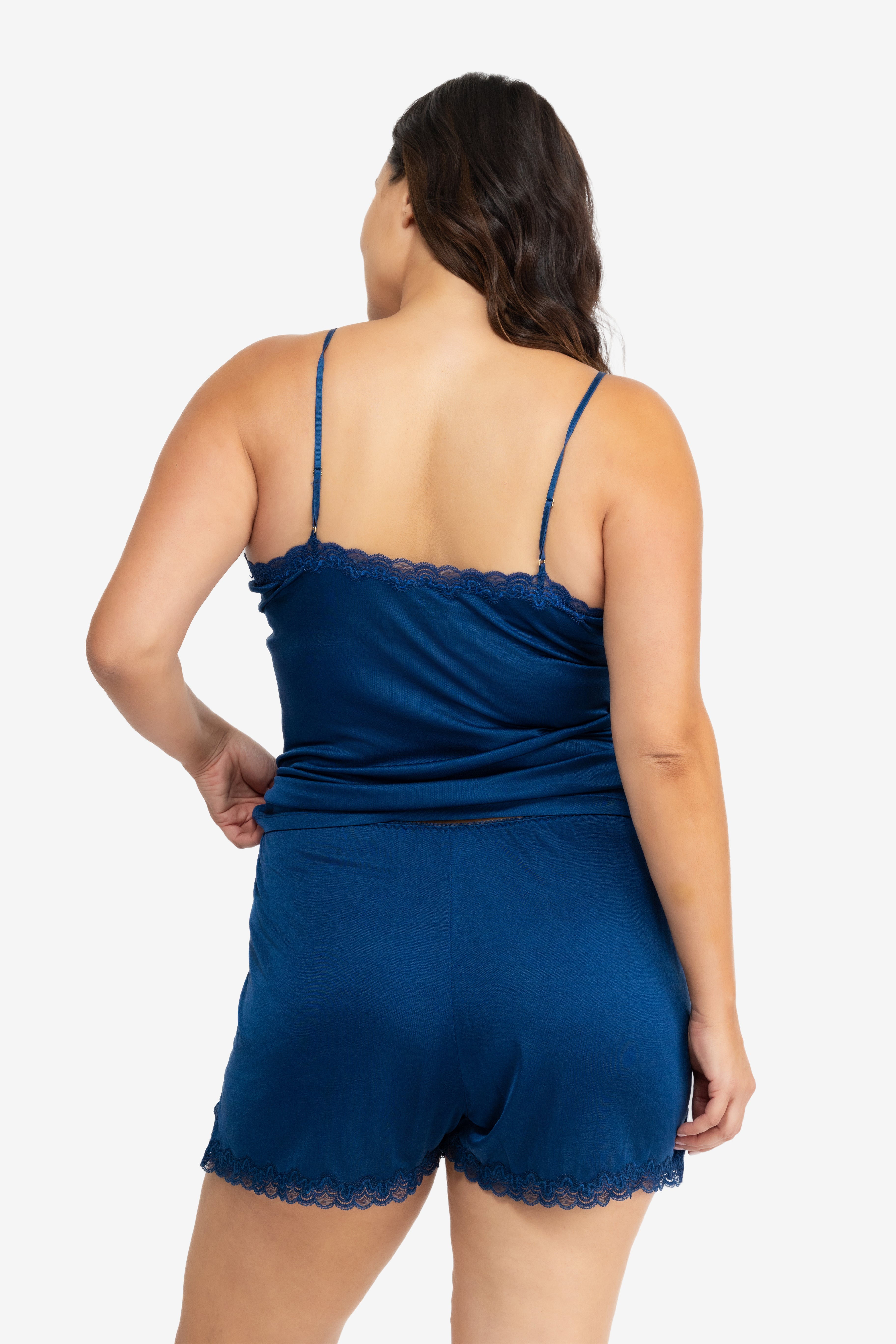 Model wearing Uwila Warrior Soft Silk Sleep Short in Estate Blue on White Background