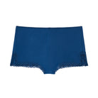 Still life of Uwila Warrior Soft Silk Sleep Shorts  in Estate Blue on White Background