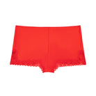 Still life of Uwila Warrior Soft Silk Sleep Shorts  in Fiery Red on White Background