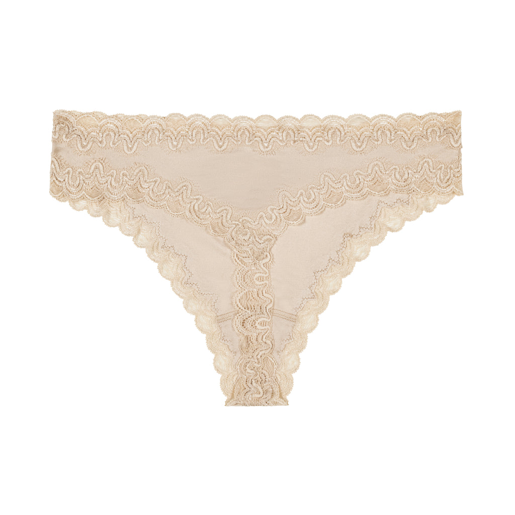 Still life of Uwila Warrior Soft Silks Thong Underwear in Smoke Grey on White Background