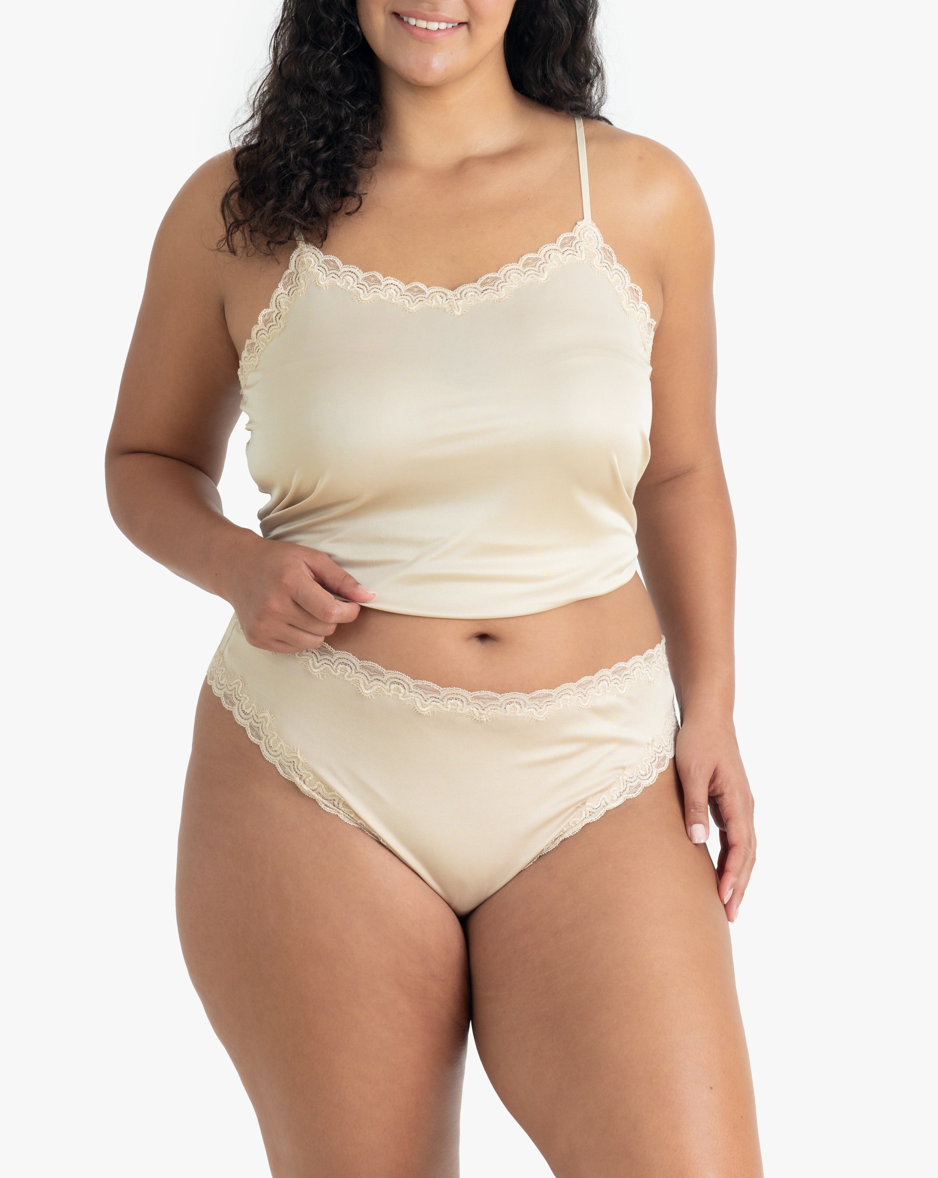 Model wearing Uwila Warrior Soft Silks Thong Underwear in Smoke Grey on White Background