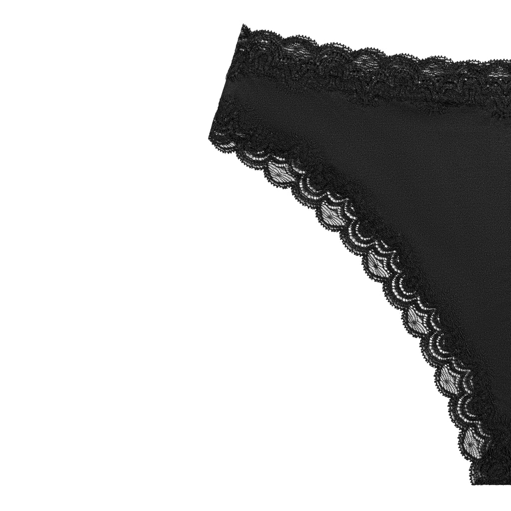 Still life of Uwila Warrior Soft Silks Thong Underwear in Tap Shoe Black on White Background