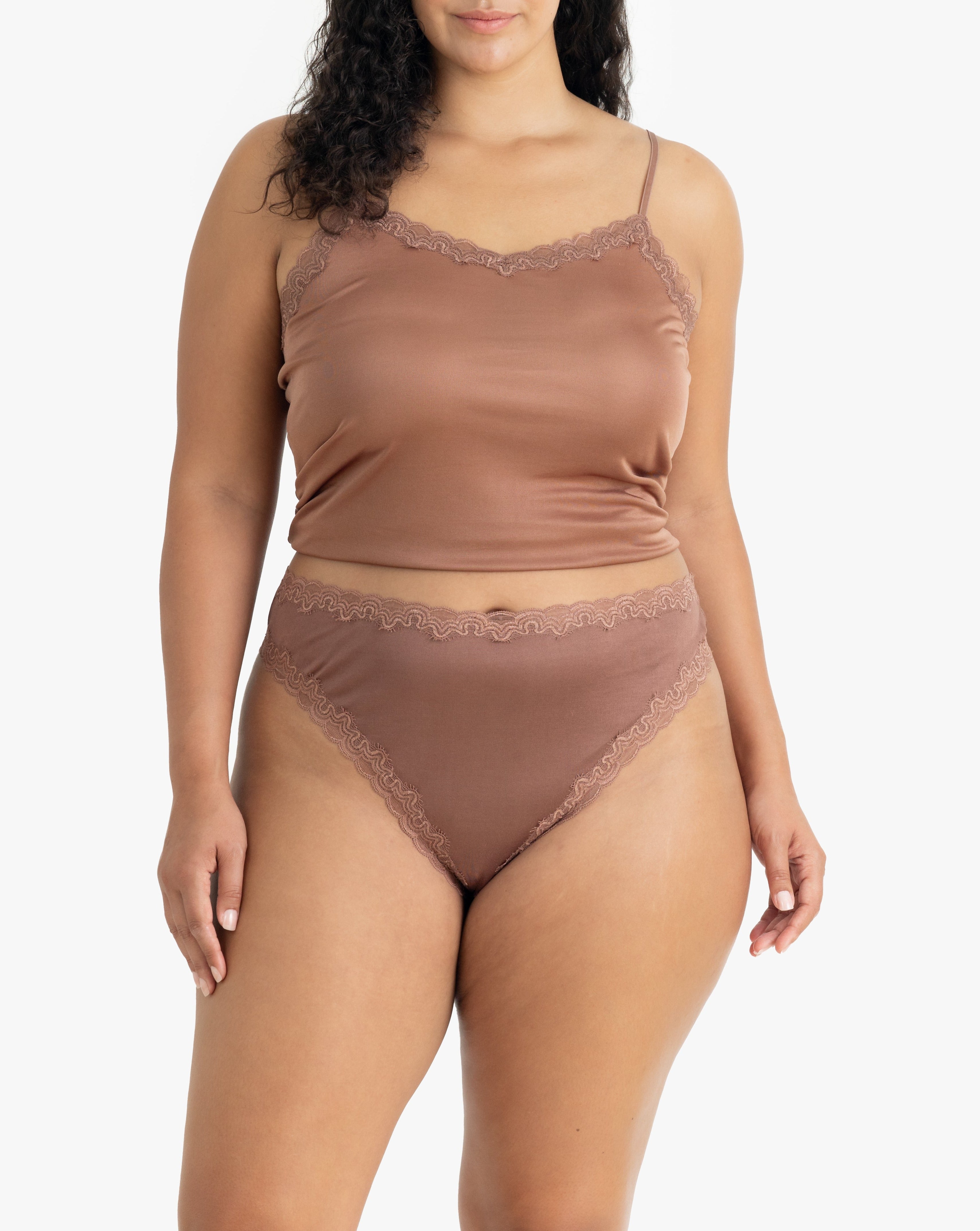Model wearing Uwila Warrior Soft Silks Thong Underwear in Toffee on White Background