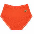 Uwila Warrior Soft Silk Brief in Spicy Orange with Embroidered Football patch on white background. 