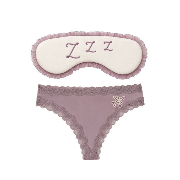Flat Lay of the Uwila Warrior Sweet Dreams Travel Set featuring the Bon Voyage Silk Thong in Nirvana and the Sleep Mask. 