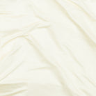 A long-sleeve Cream base layer T-shirt by Uwila Warrior, shown in against a white background.
