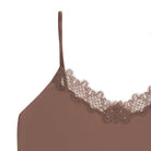 A toffee soft seamless  lace-trimmed camisole against a light gray background