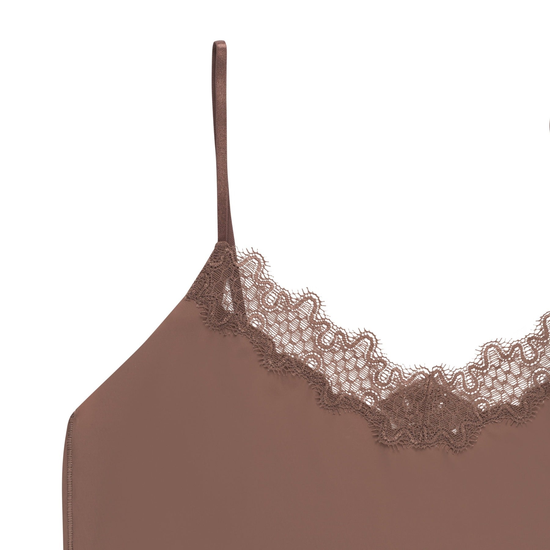 A toffee soft seamless  lace-trimmed camisole against a light gray background