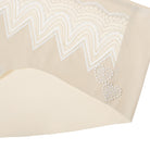 A pair of smoke grey seamless bridal briefs with intricate lace detailing.