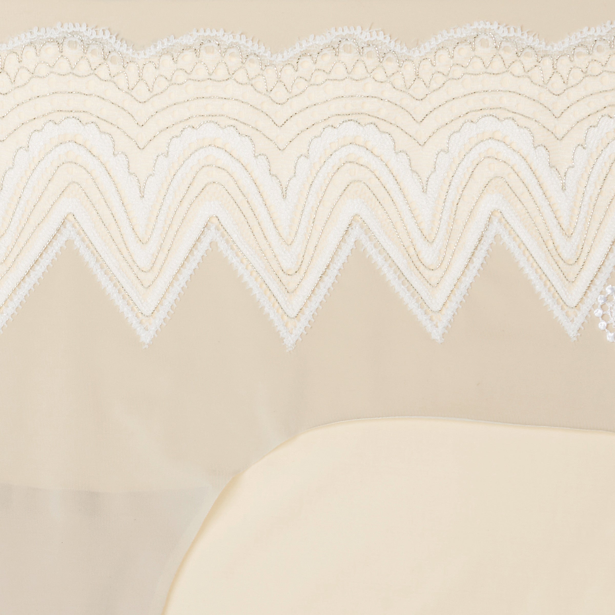 A pair of  smoke grey seamless bridal briefs with intricate lace detailing.