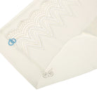 A pair of whisper white seamless bridal briefs with intricate lace detailing.