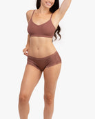 Model wearing a toffee bralette against a white background.