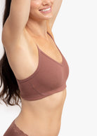 Model wearing a toffee bralette against a white background.