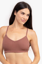 Model wearing a toffee bralette on a white background.