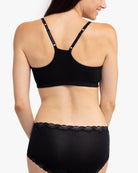 Model wearing a Tap Shoe Black bralette against a white background.