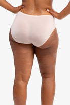 Model wearing the Almond No-Brainer Brief against a white background.
