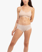 Model wearing a Smoke Grey bralette against a white background.