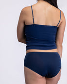 Model wearing the dress blue No-Brainer Brief against a white background